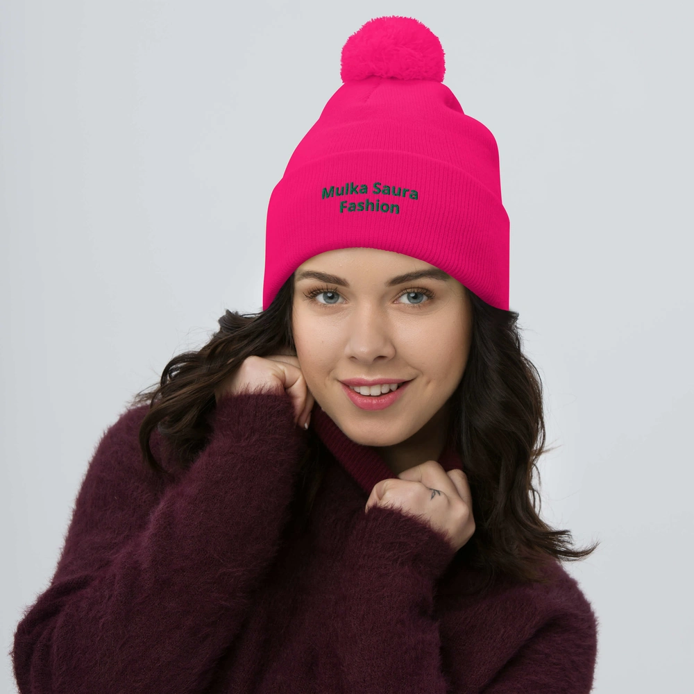 Woman in pink beanie and maroon sweater.
