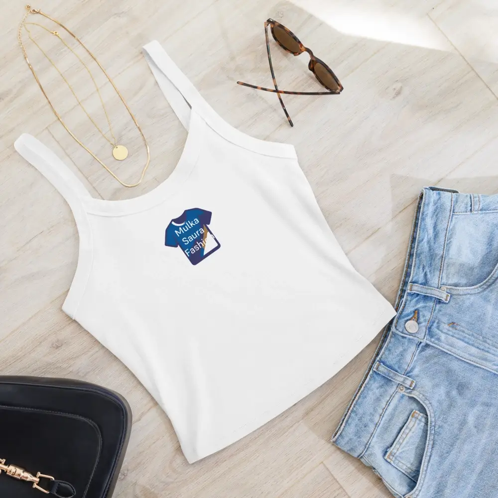 White tank top with accessories on floor.