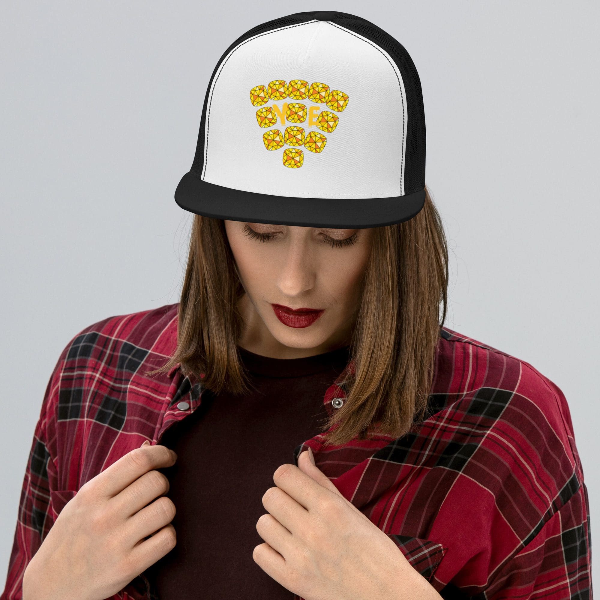 Woman wearing Wi-Fi design cap, plaid shirt.