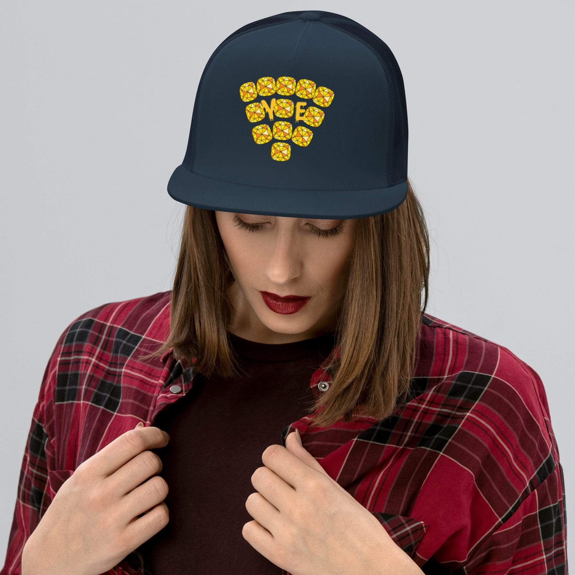 Woman in plaid shirt wearing WiFi hat.