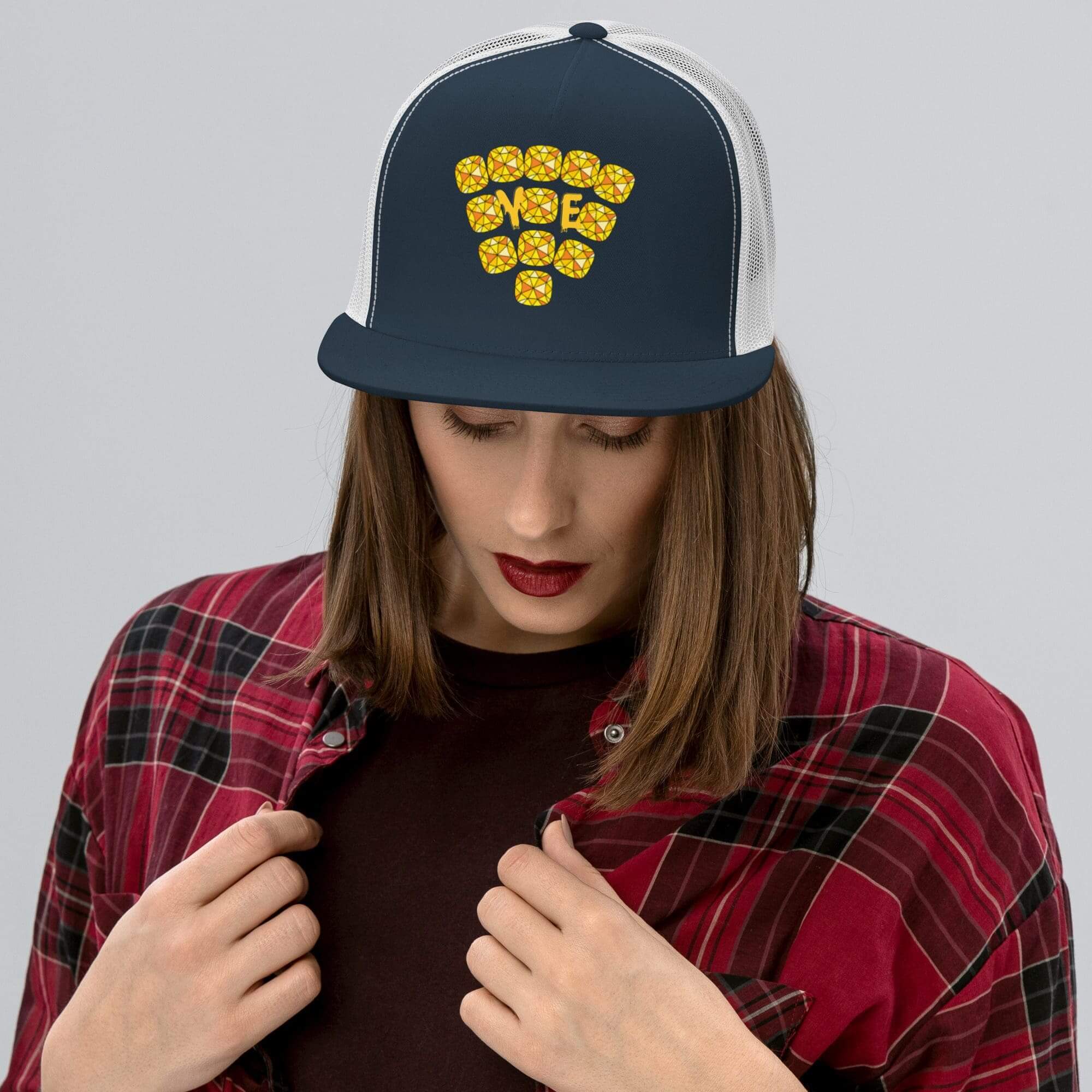 Woman in cap with bee design.