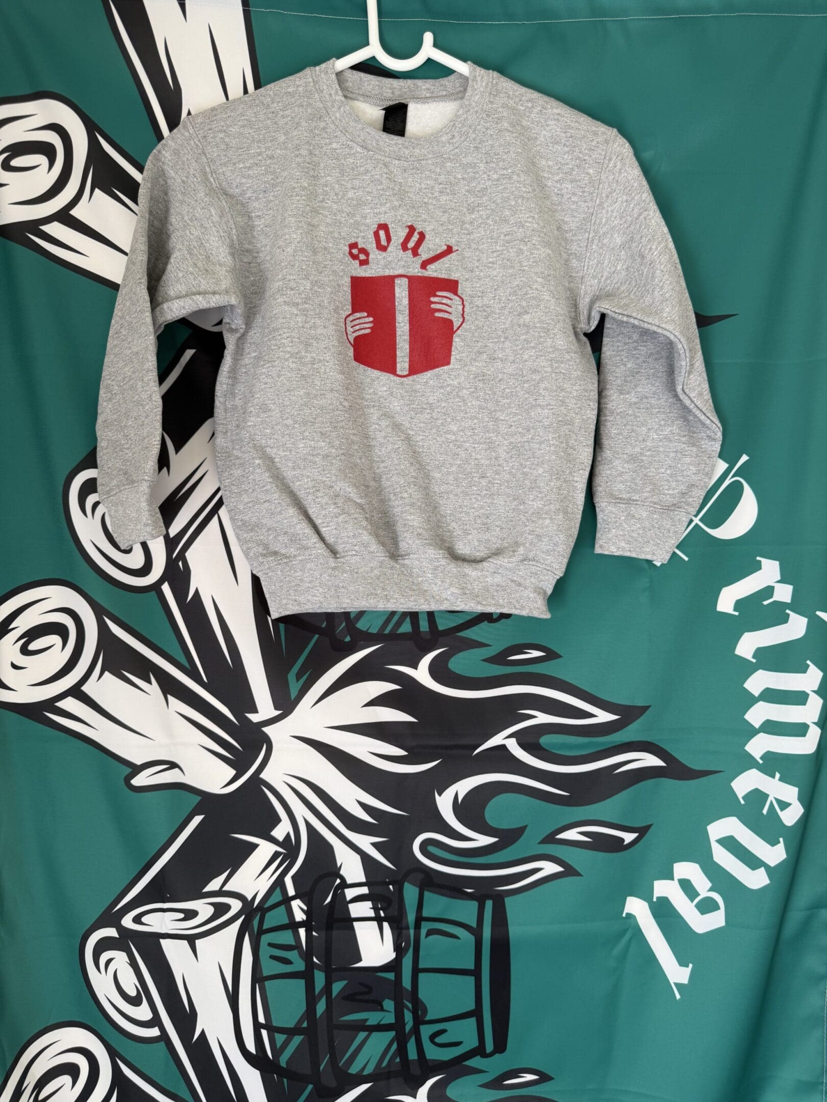 Gray sweatshirt with "soul" and book graphic.
