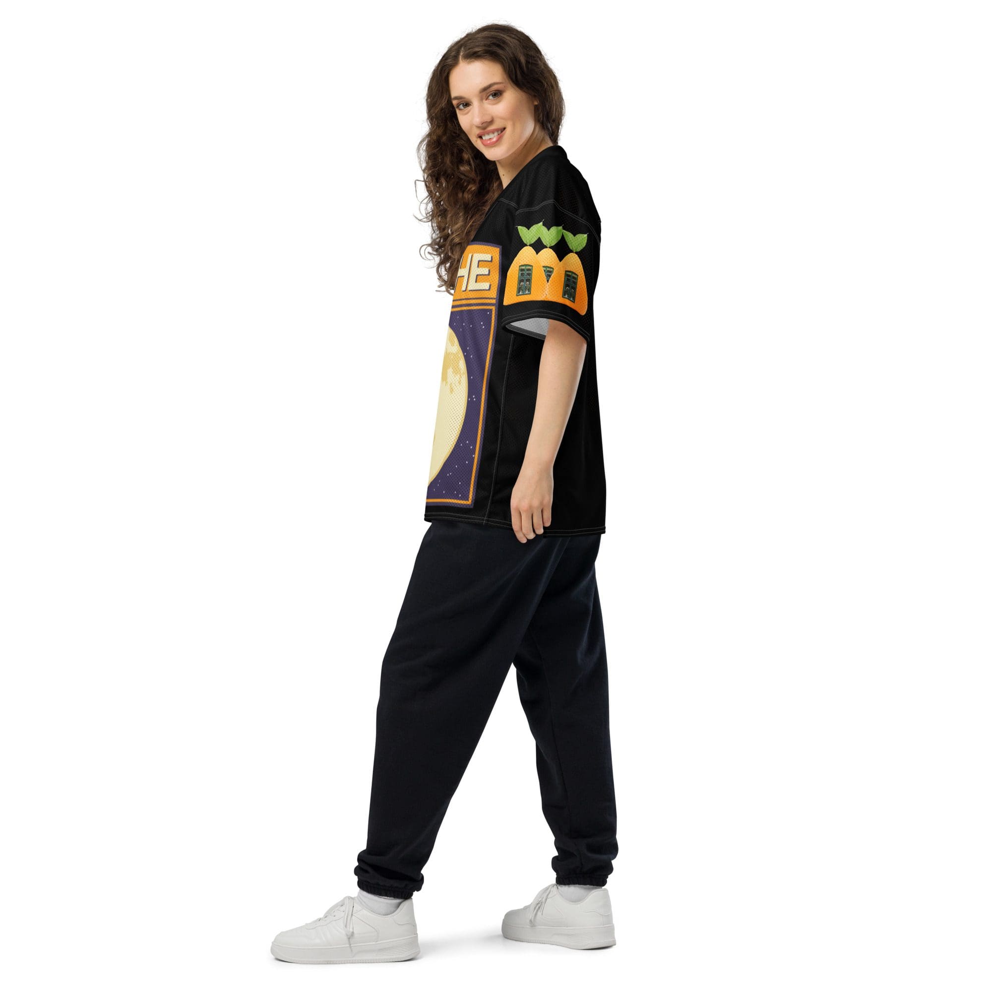 Smiling woman in casual black outfit.