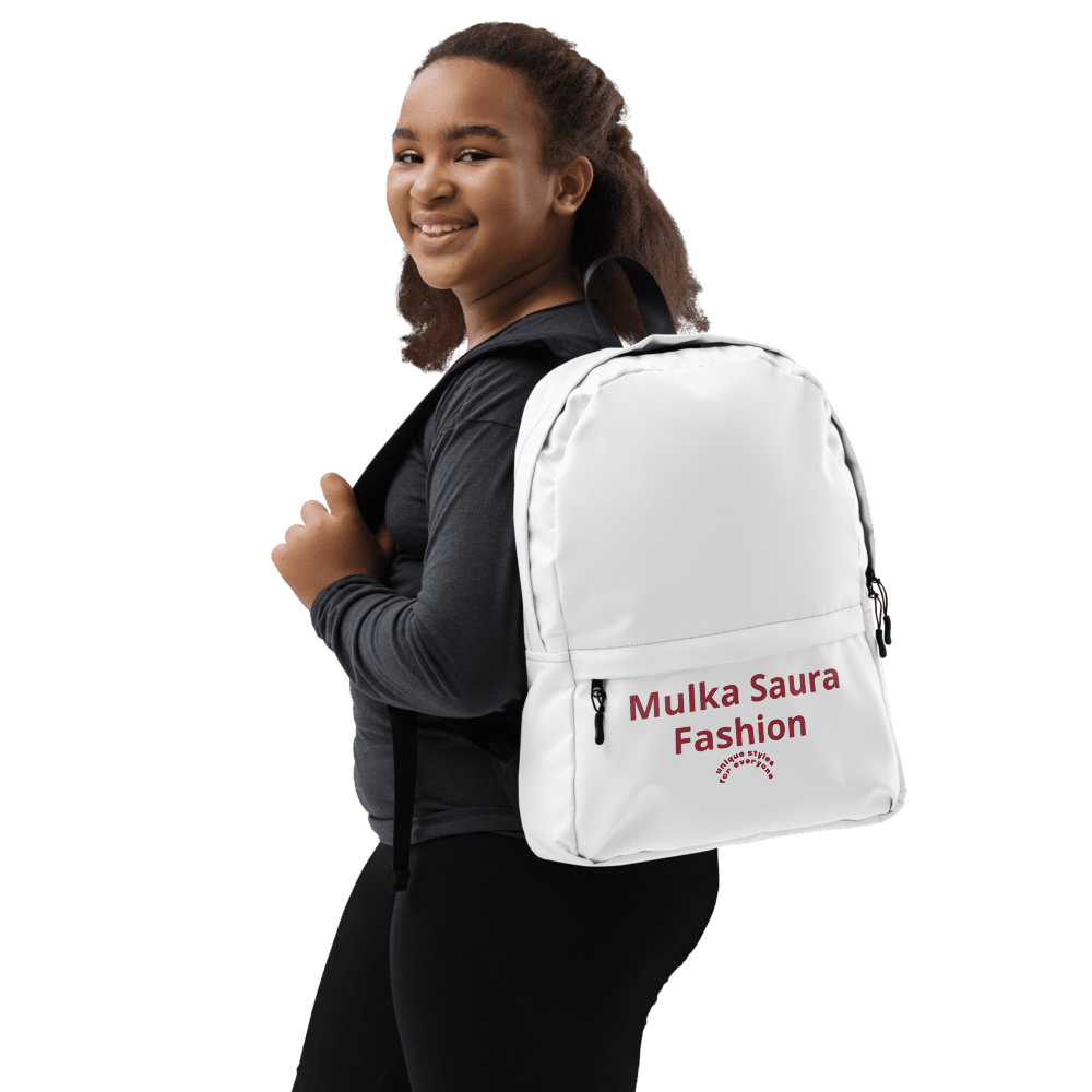 Person wearing a white backpack, smiling.