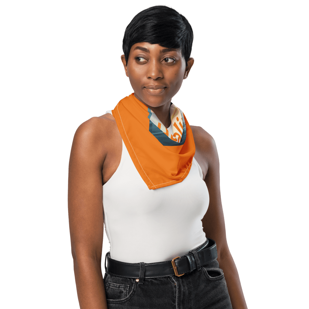 Woman wearing orange scarf and white top.