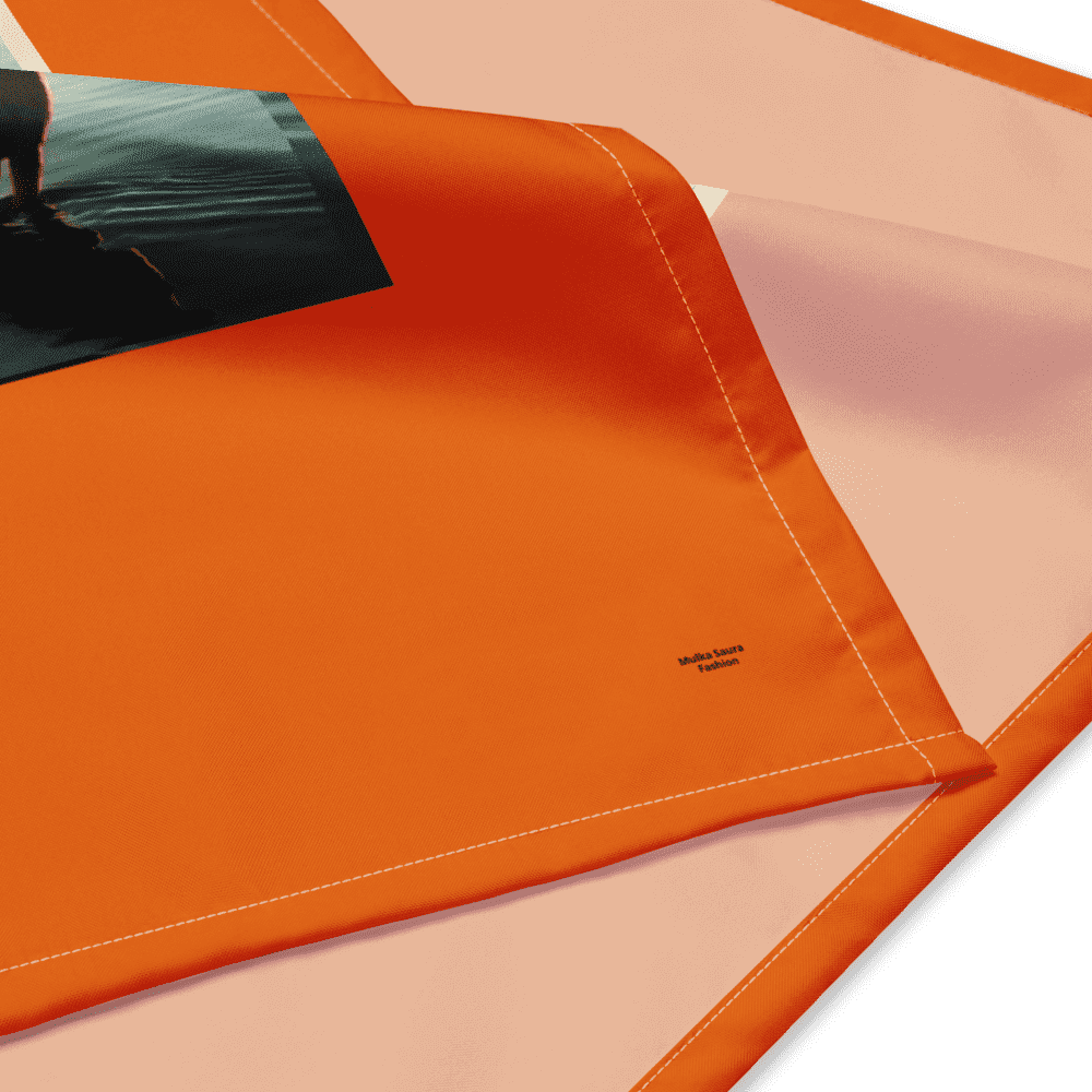 Orange and pink fabric with print detail.