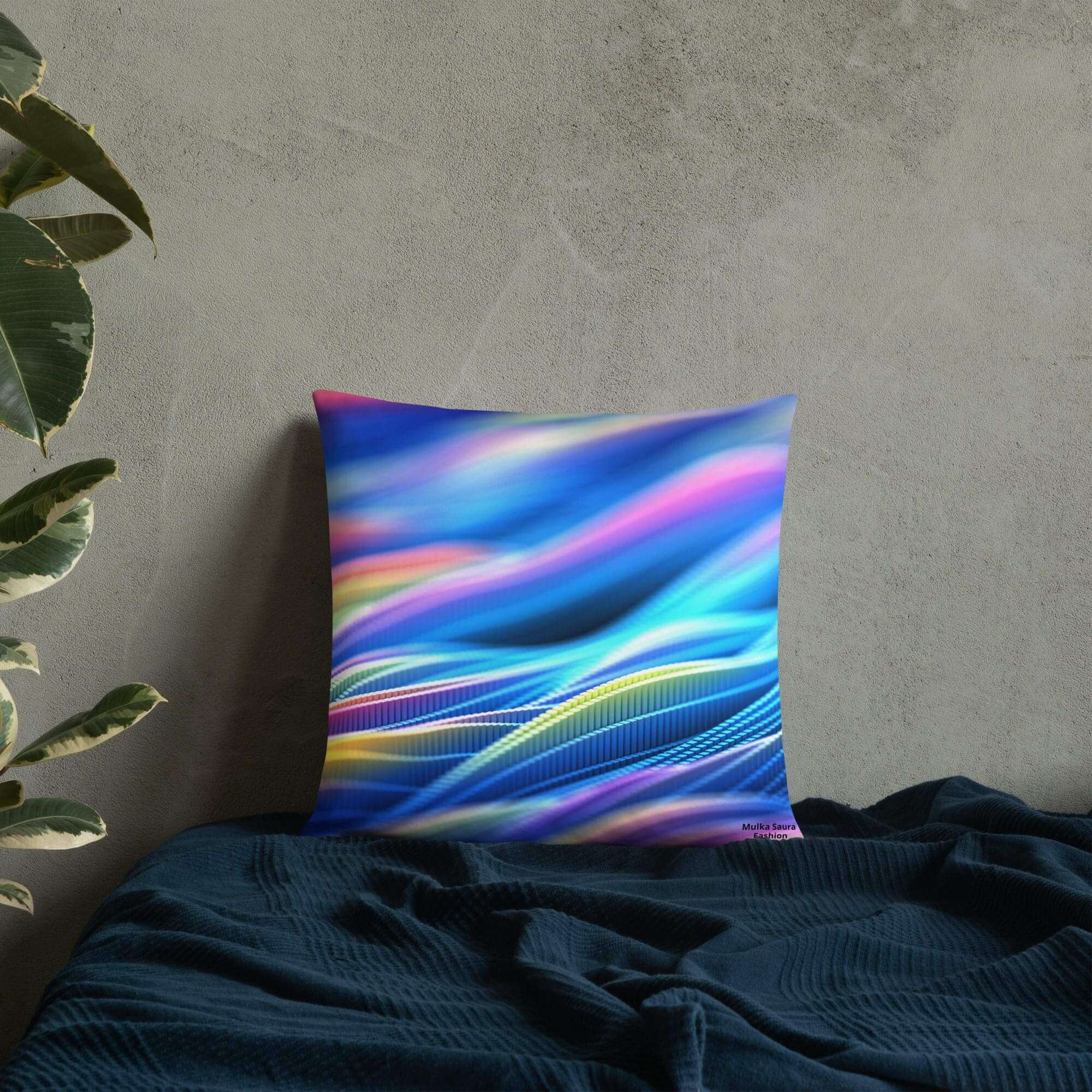 Colorful abstract pillow on dark bedspread.