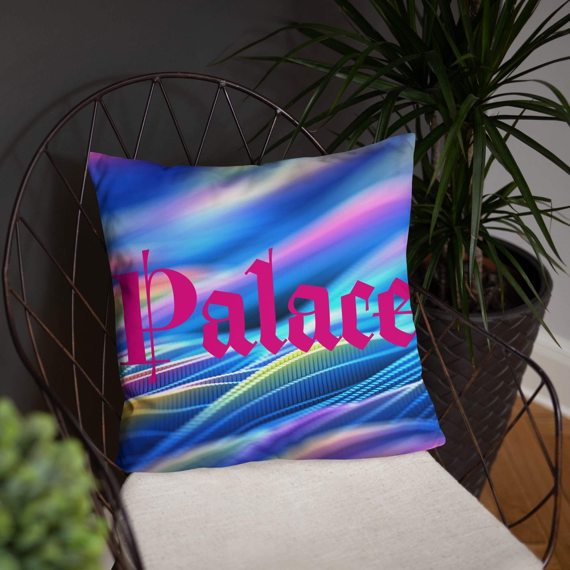 Colorful pillow with "Palace" on metal chair.