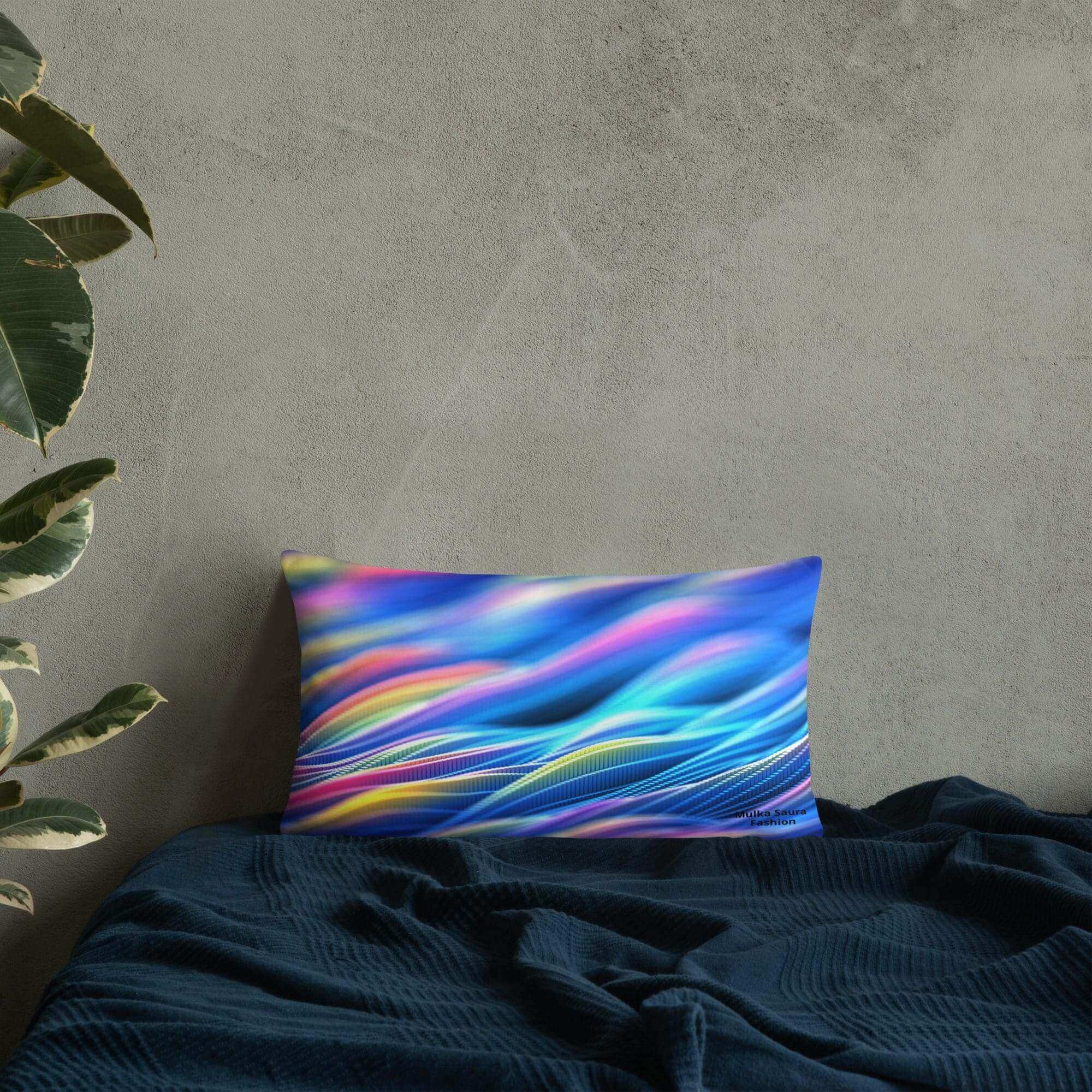 Colorful pillow on a dark blue bed.