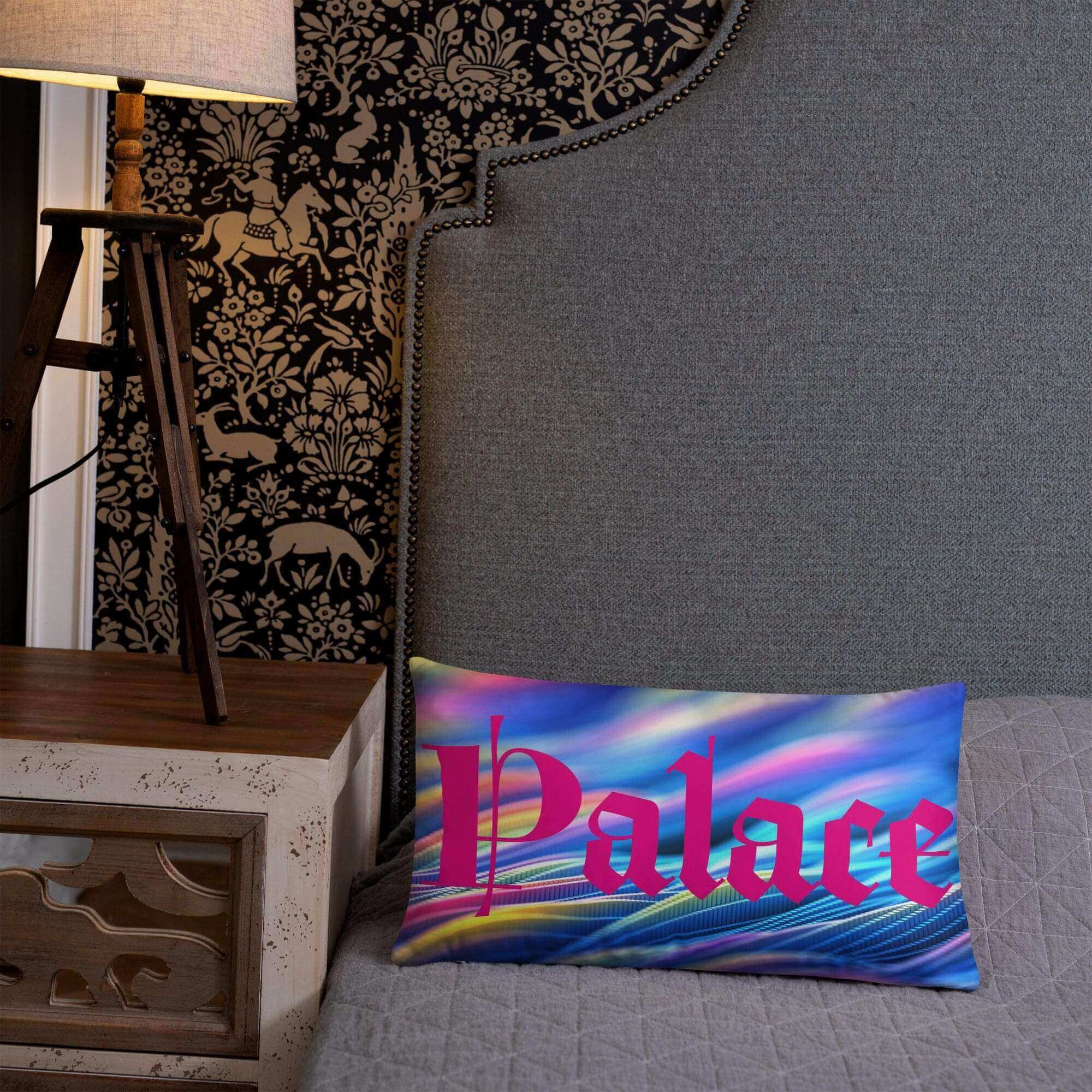 Colorful pillow on bed with intricate wallpaper.