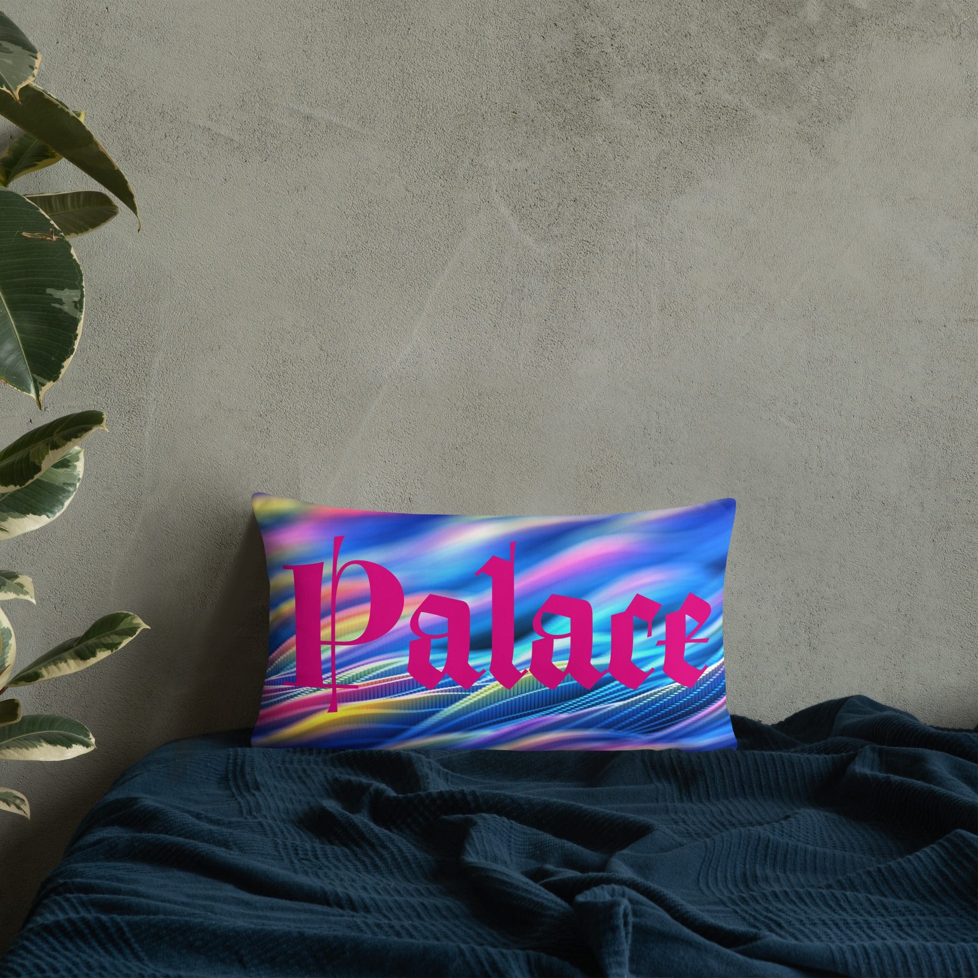 Colorful pillow with "Palace" on dark bedding.