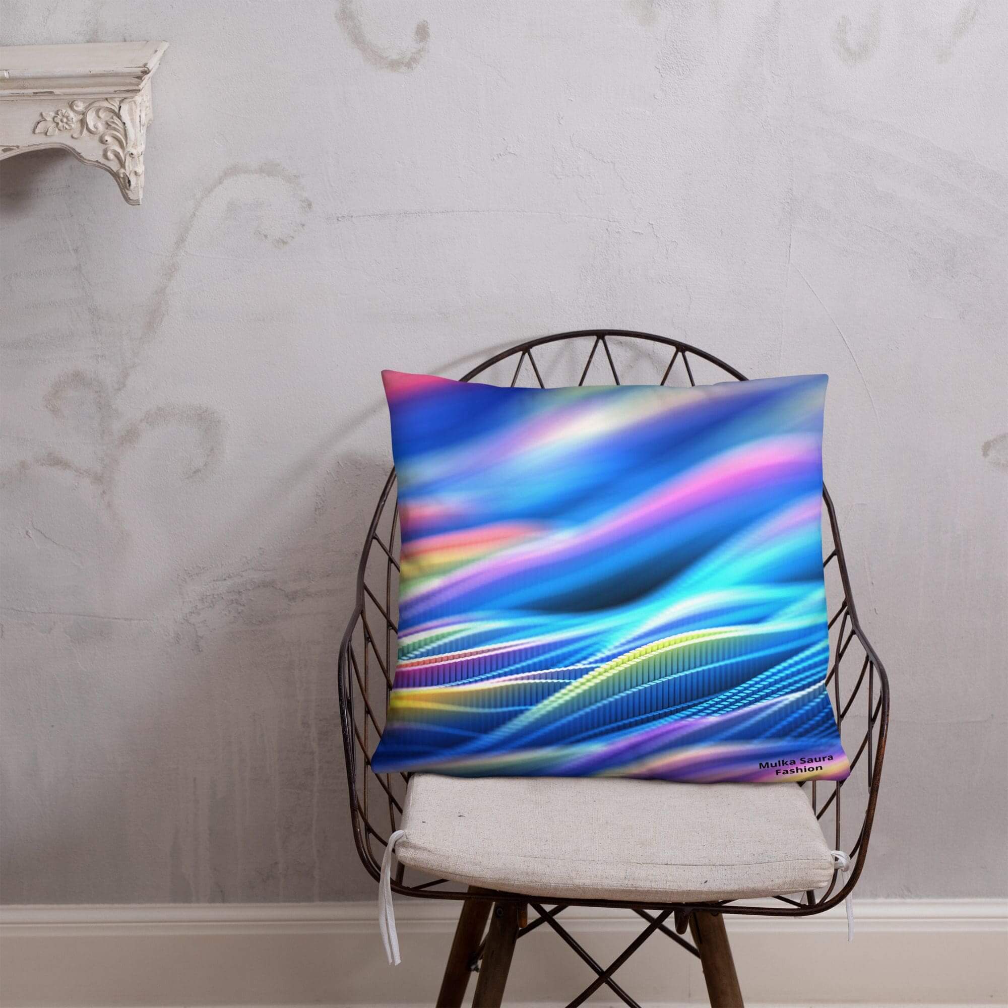 Colorful abstract design pillow on chair.