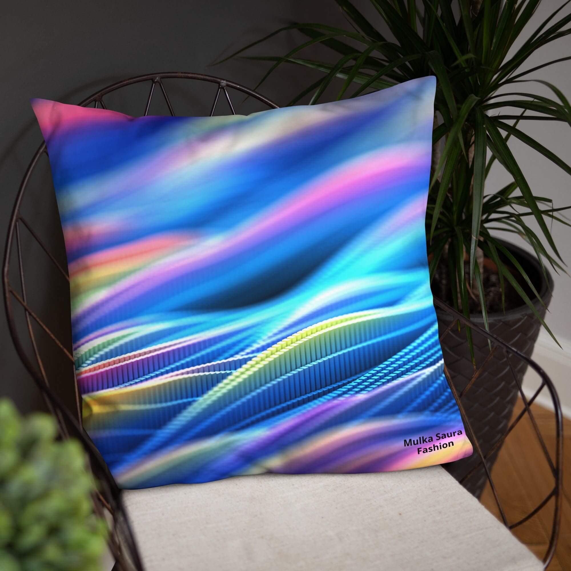 Colorful abstract pillow on a metal chair.