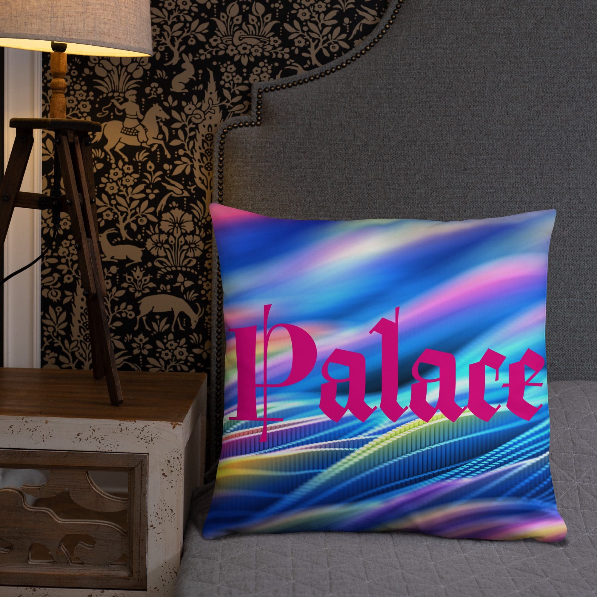Colorful cushion on chair beside ornate wallpaper.