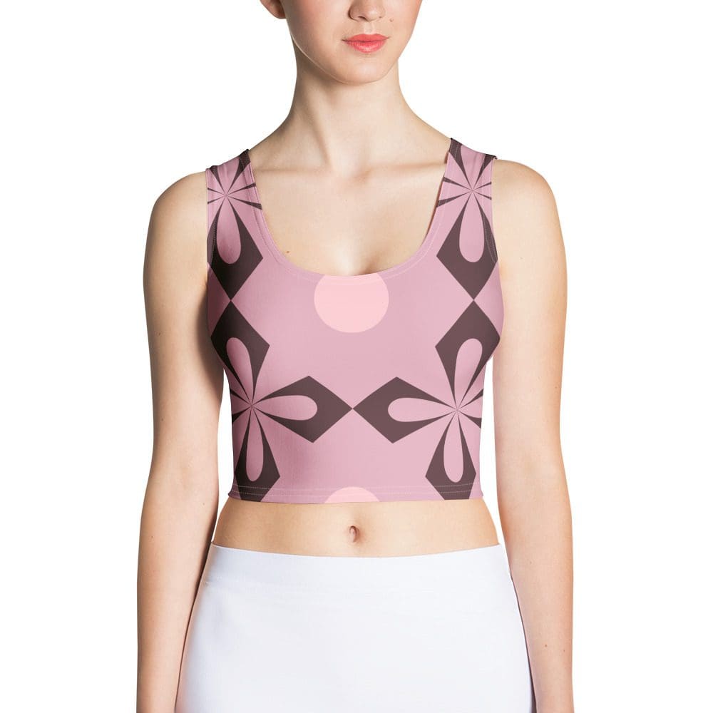 Woman wearing pink geometric patterned crop top.