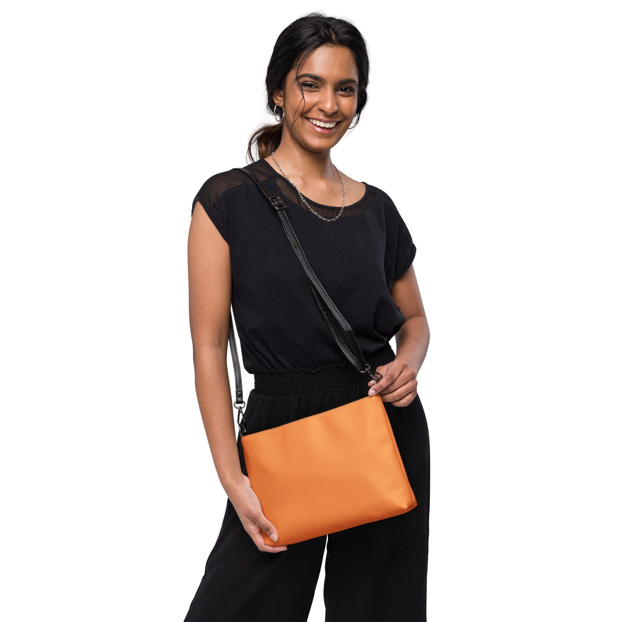 Smiling woman holding an orange purse.