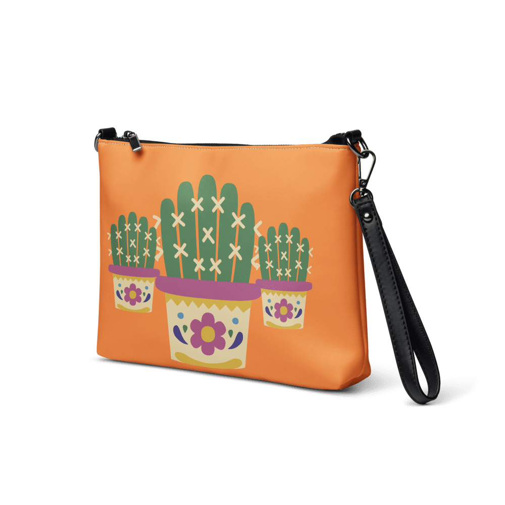 Orange bag with cactus plant design.