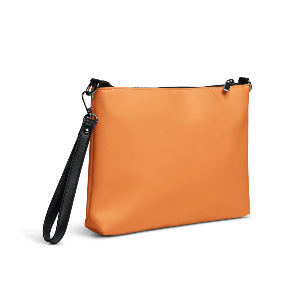 Orange clutch bag with black wrist strap.