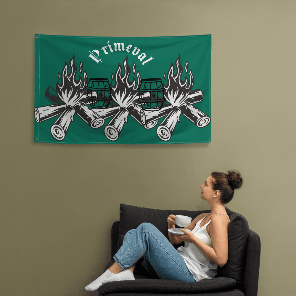Woman sitting under green "primeval" banner.
