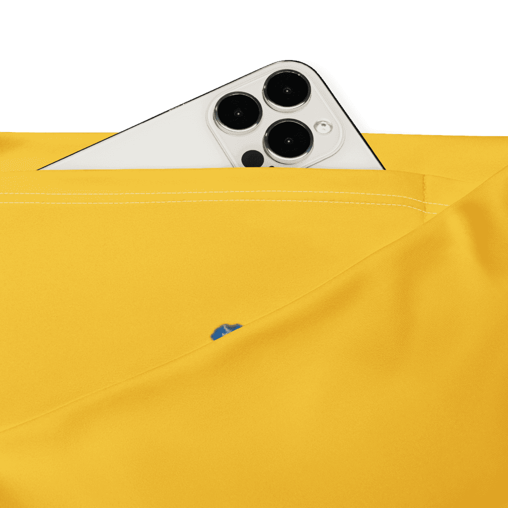 Phone peeking from yellow fabric pocket.