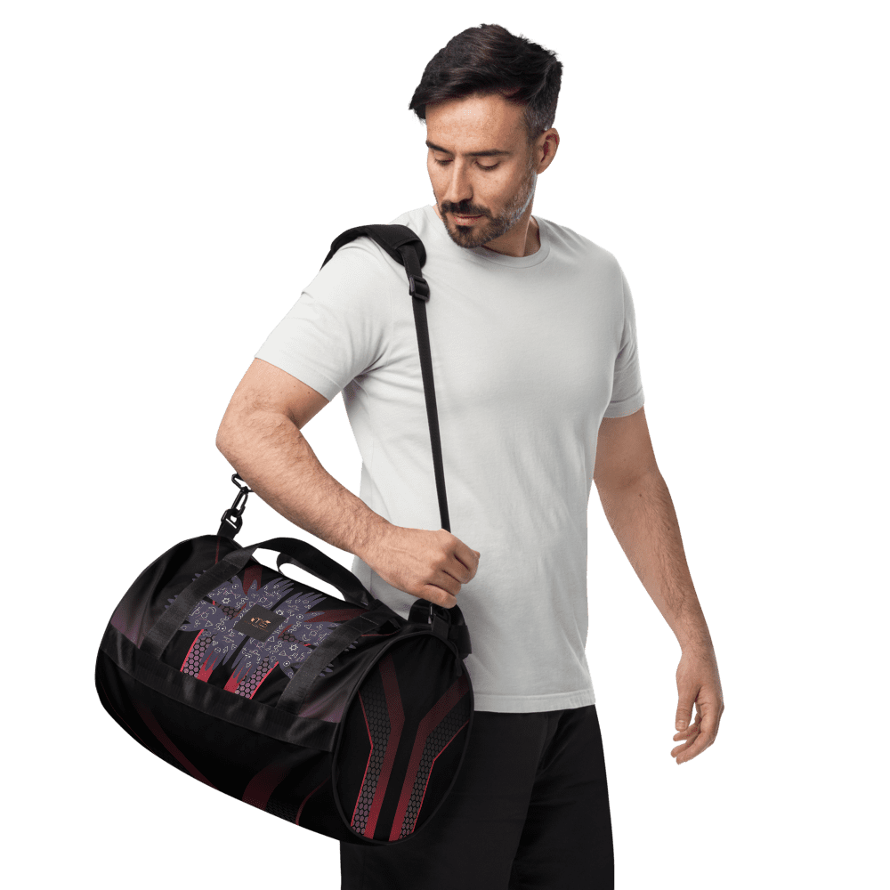 Man holding a black duffel bag.