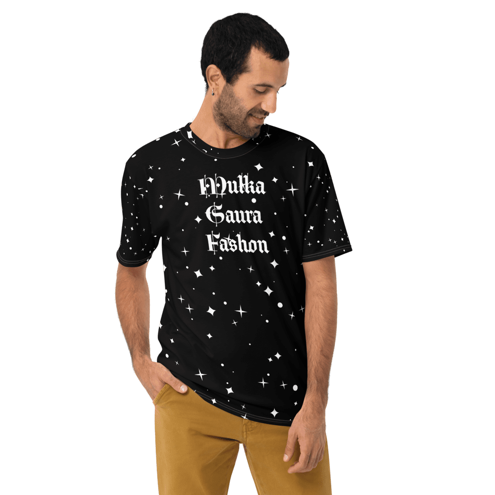 Man wearing starry black t-shirt, smiling.