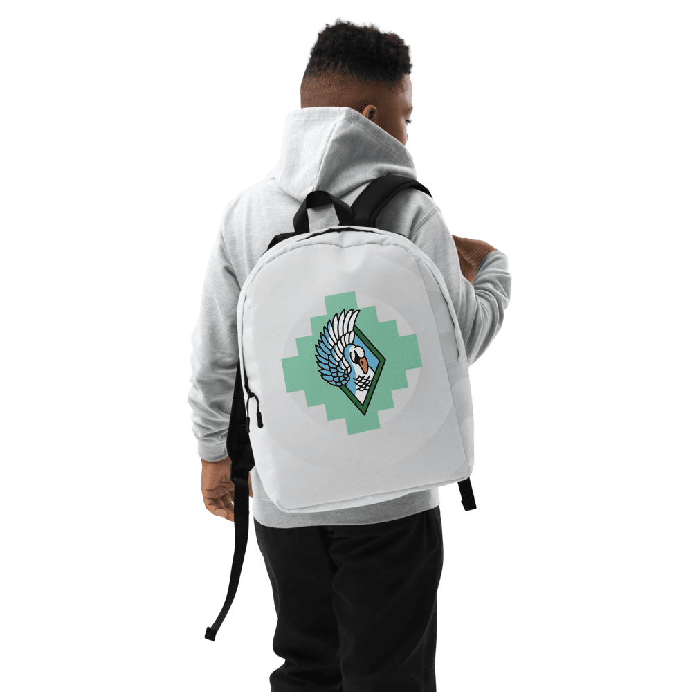 Person wearing backpack with winged emblem.