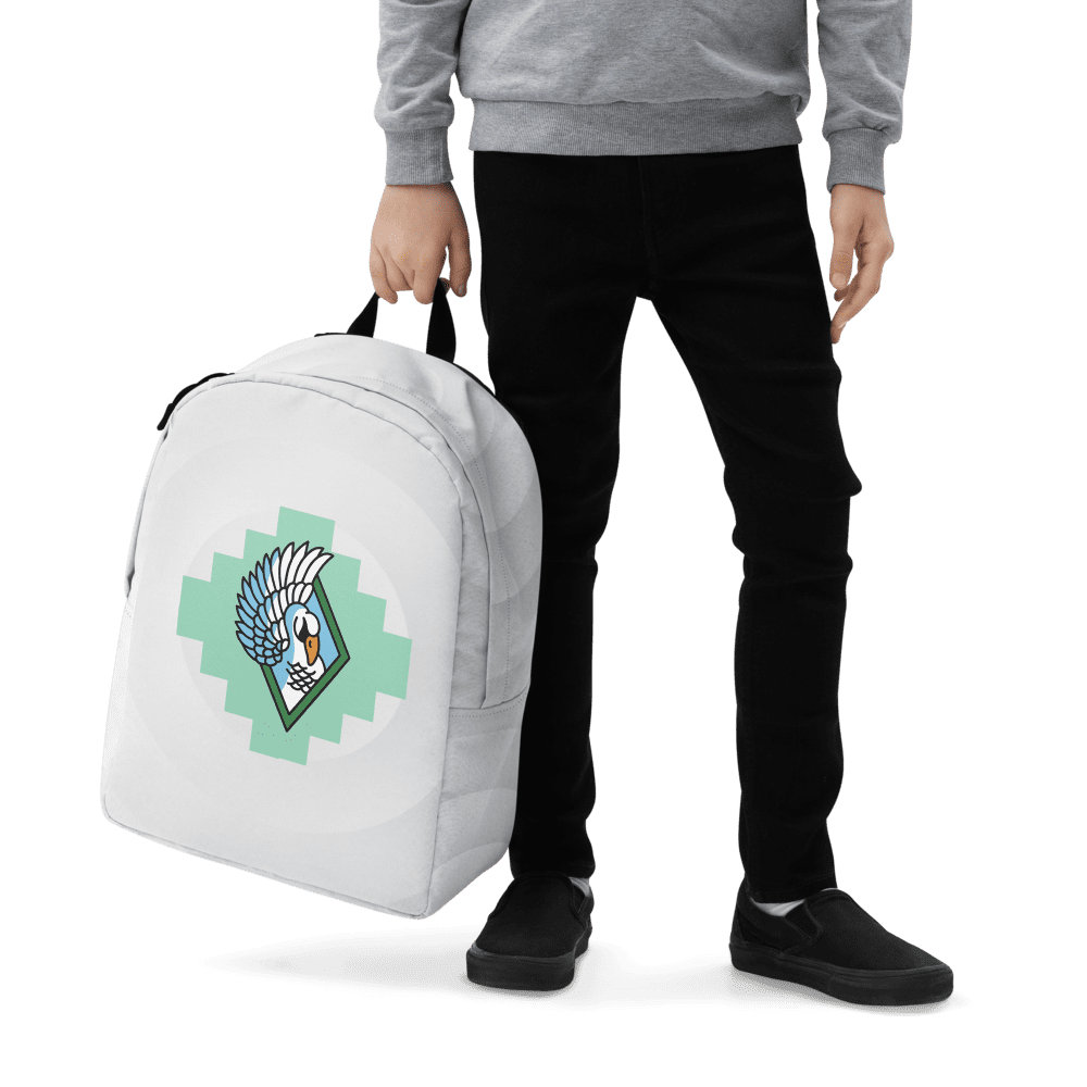 Person holding backpack with bird design.