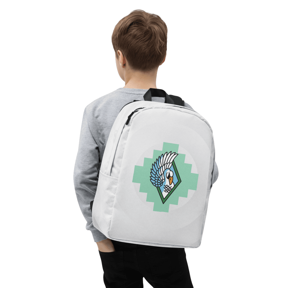 Child wearing white backpack with bird emblem