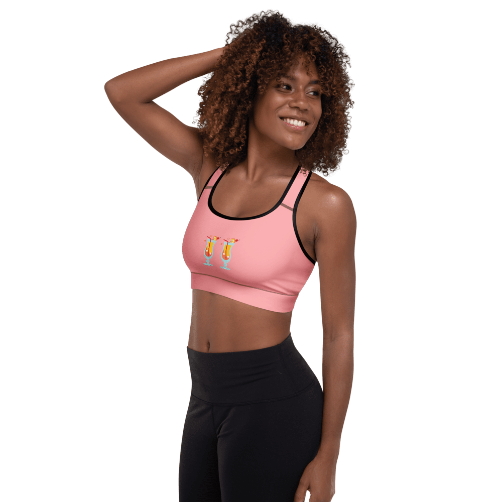 Smiling woman in pink athletic top.
