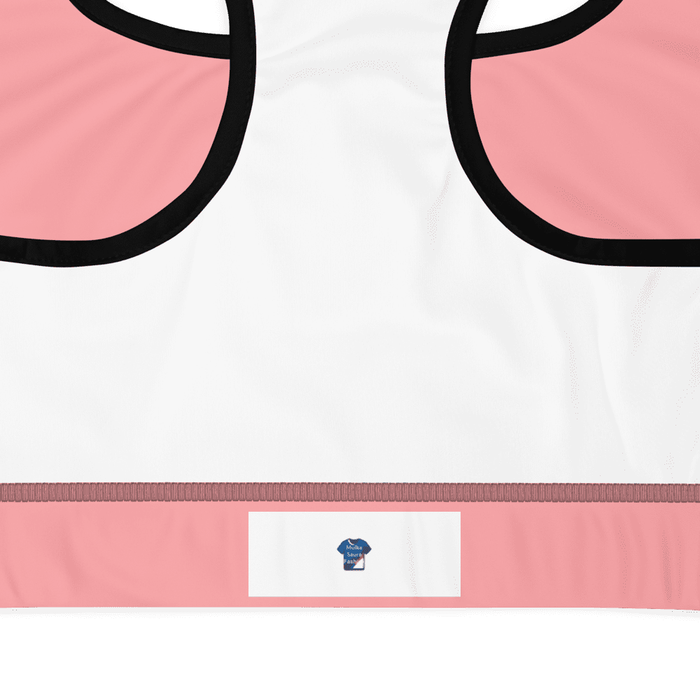 Pink and white sports bra, cupcake logo.