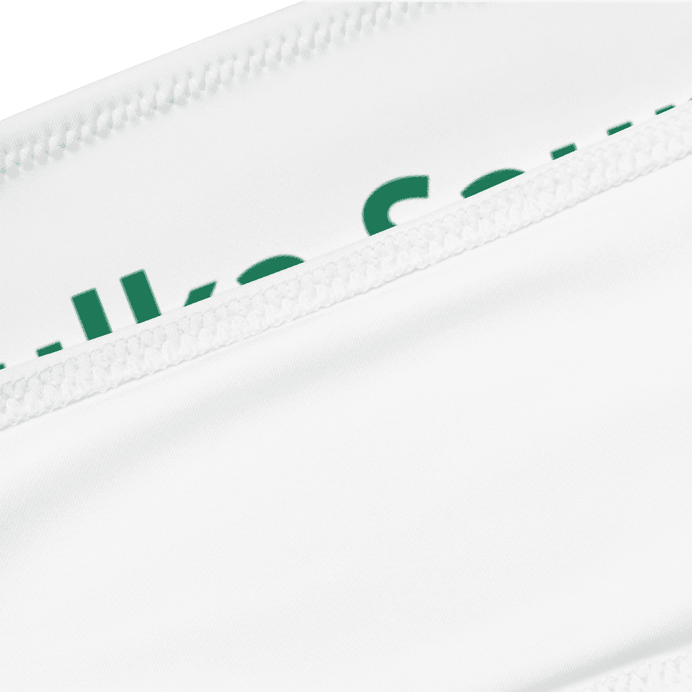 White fabric with green text partially visible.