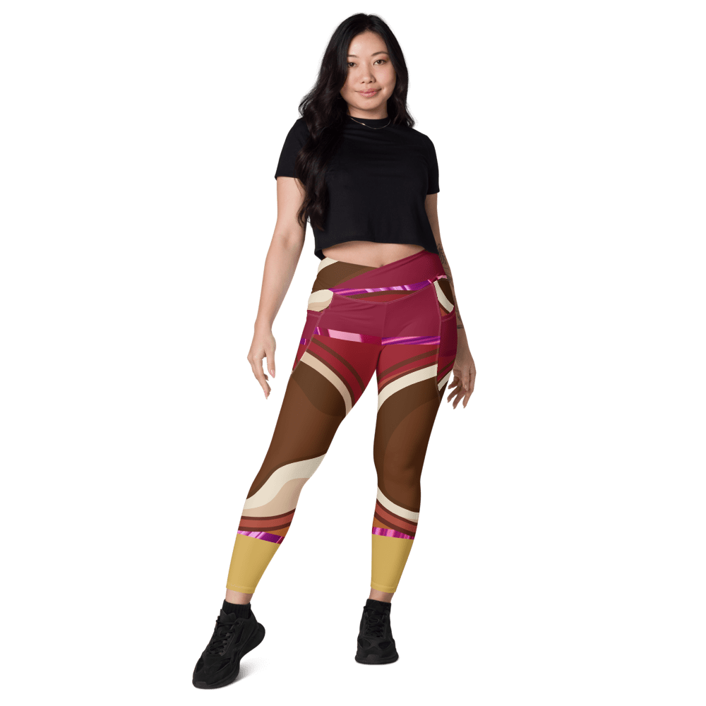Woman wearing colorful geometric leggings, black top.