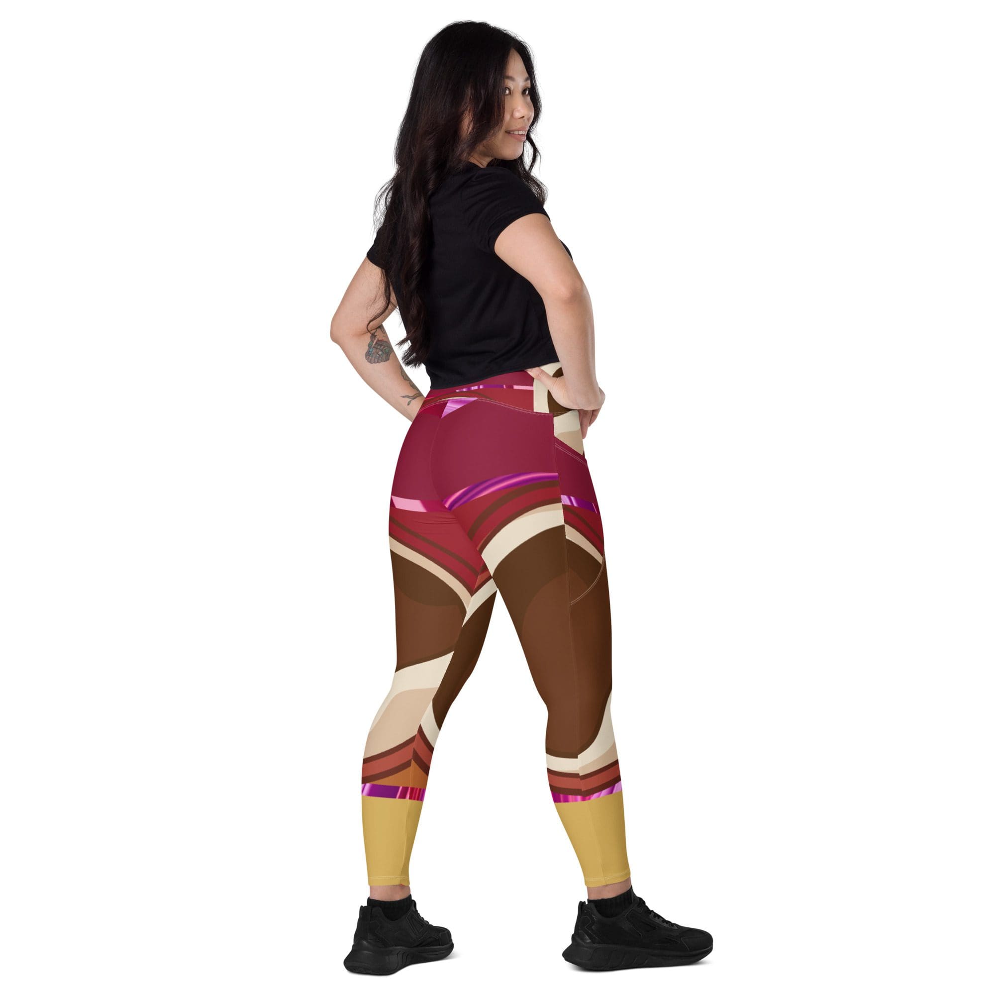 Woman wearing colorful abstract design leggings.