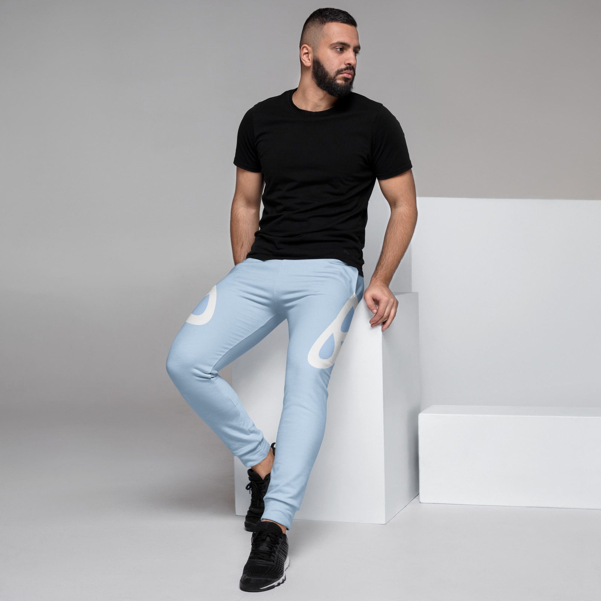 Man in black shirt and light blue pants.