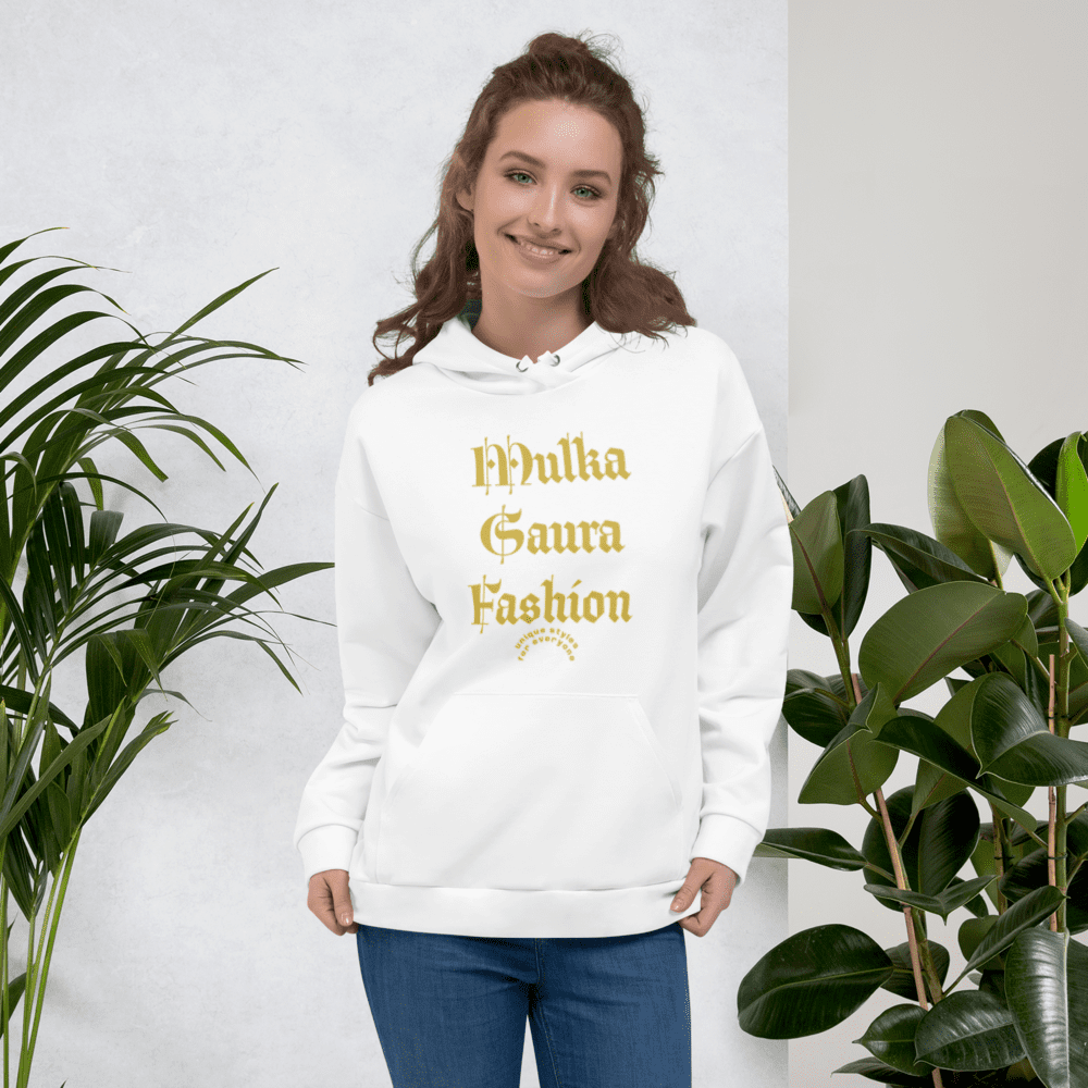 Woman in white hoodie with plants.