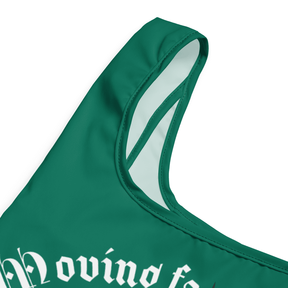 Green sports jersey with white lettering detail.