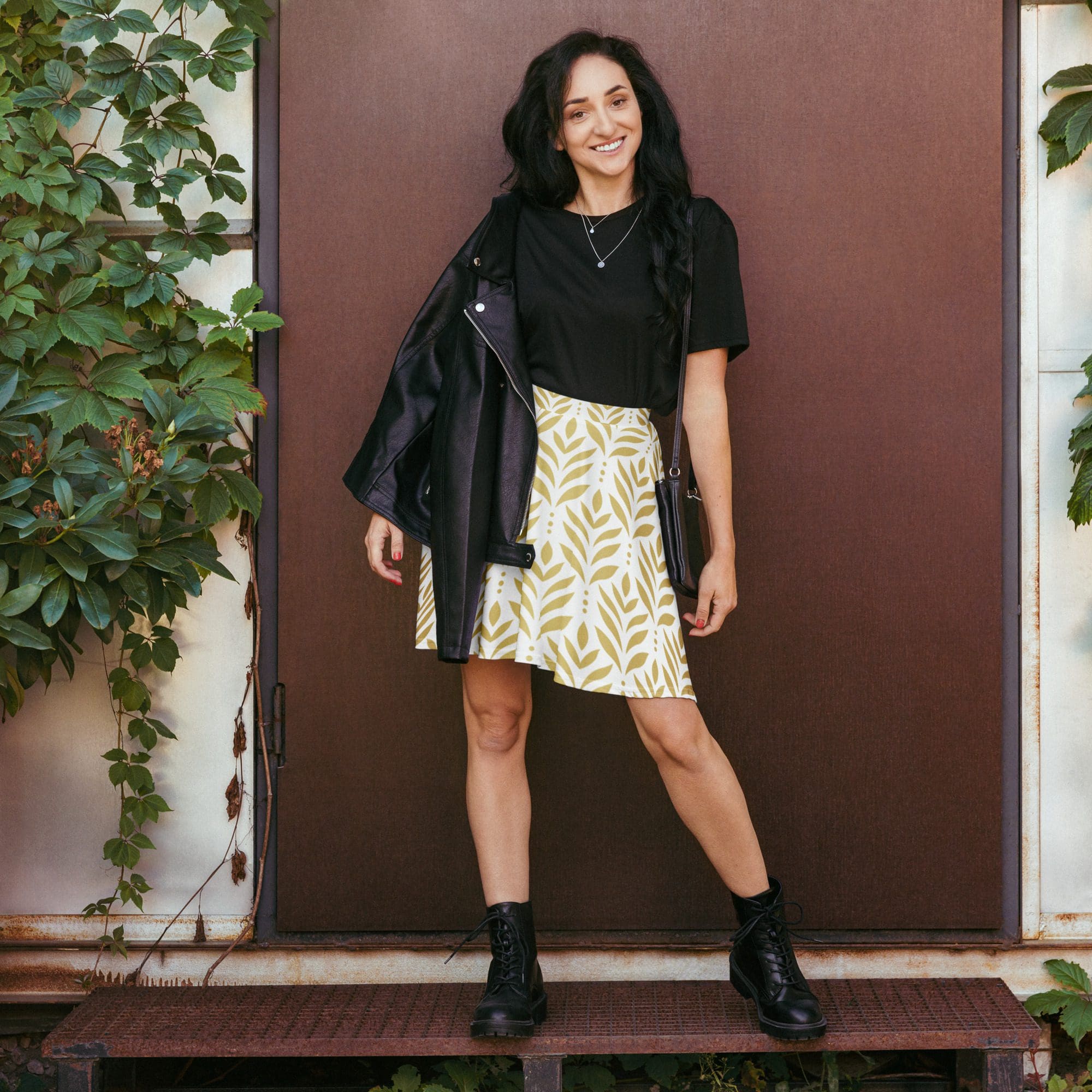 Smiling woman in stylish outfit, outdoor setting.