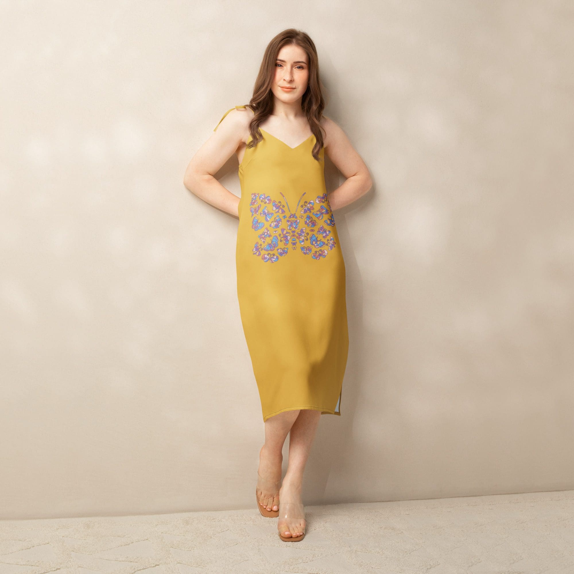 Woman in yellow dress with floral design.