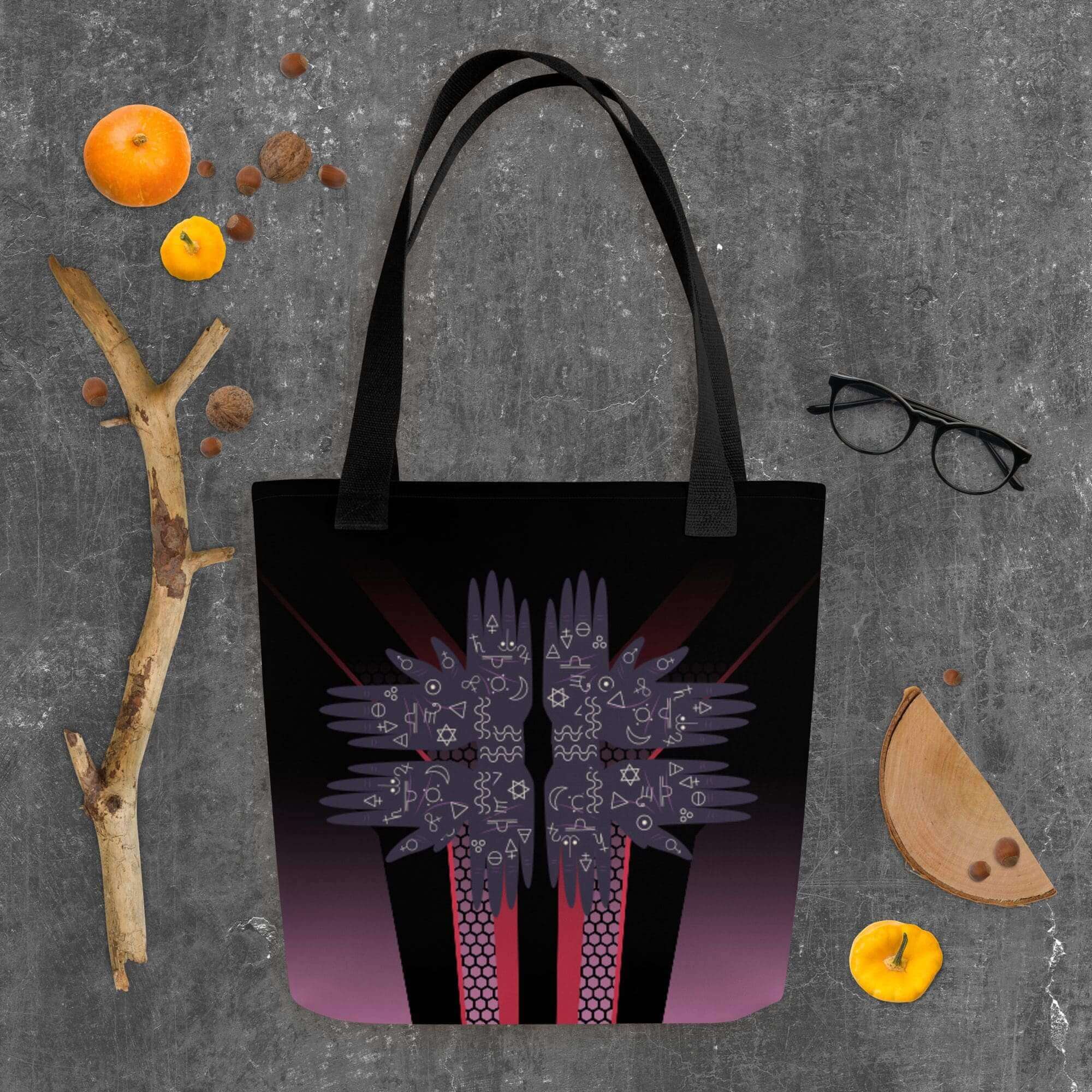 Tote bag with abstract design and accessories.