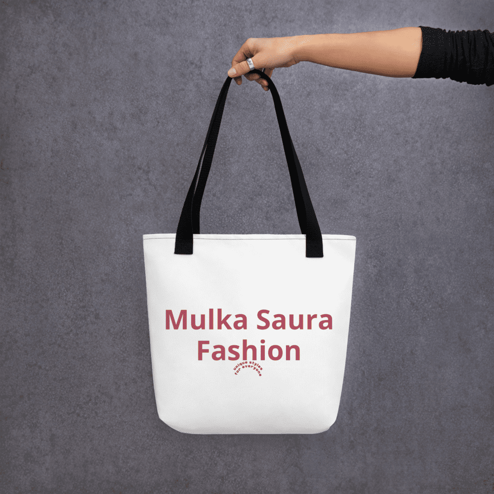 Person holding a white tote bag.