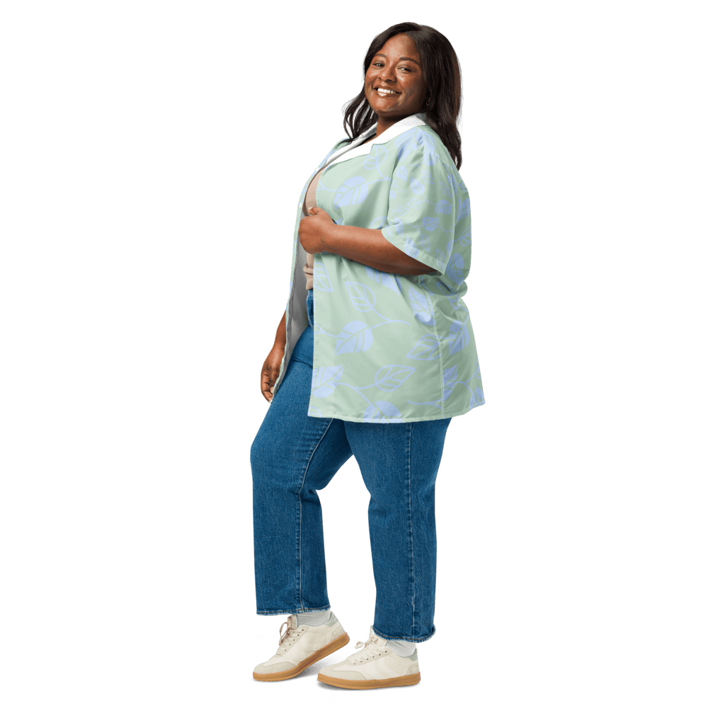 Smiling woman in casual outfit, black background.