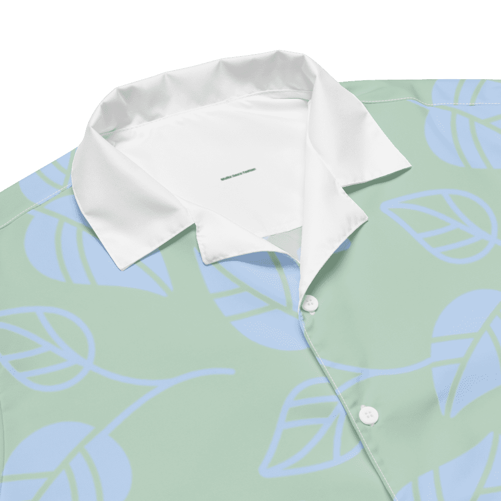 Green shirt with white leaf pattern.