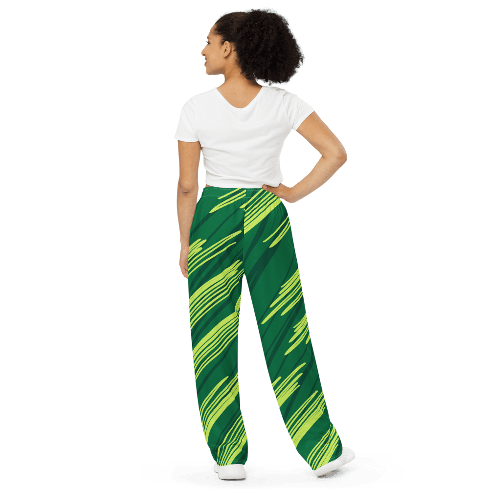 Woman in green patterned pants, white shirt.