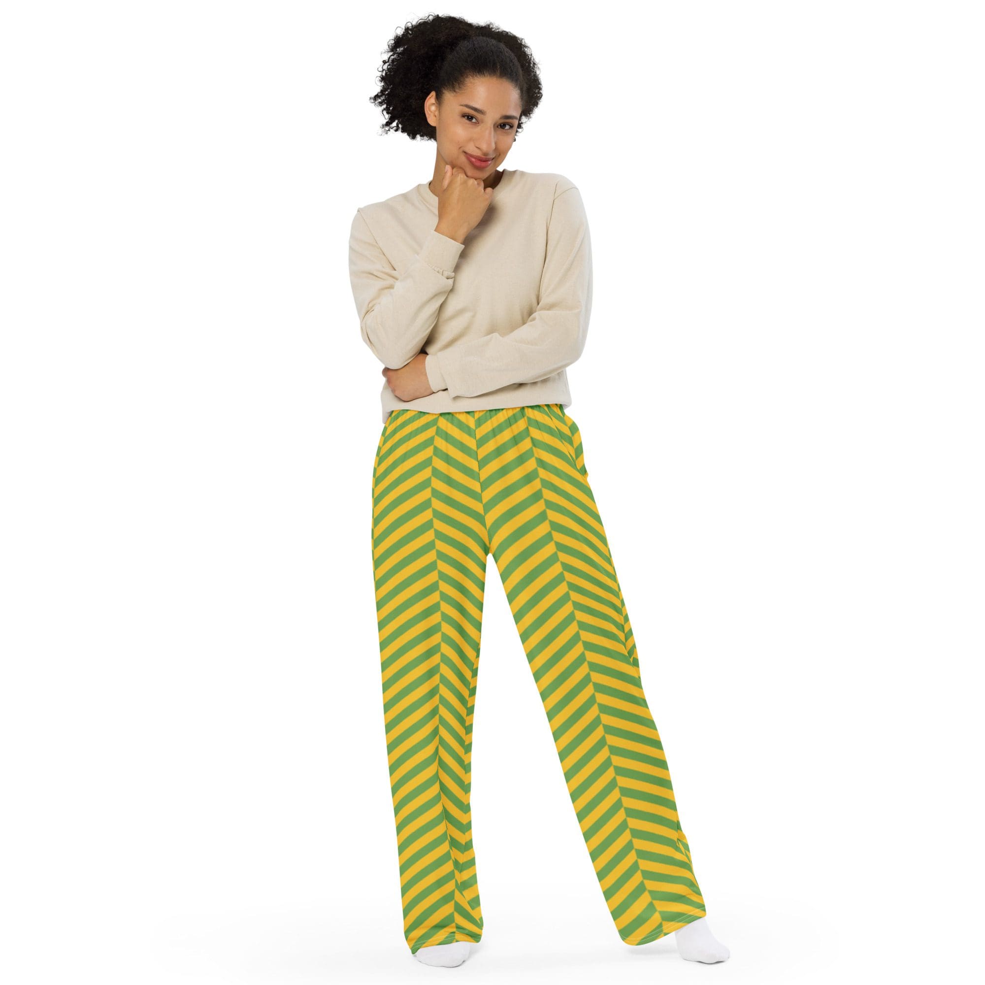 Person wearing striped pants and beige sweater.