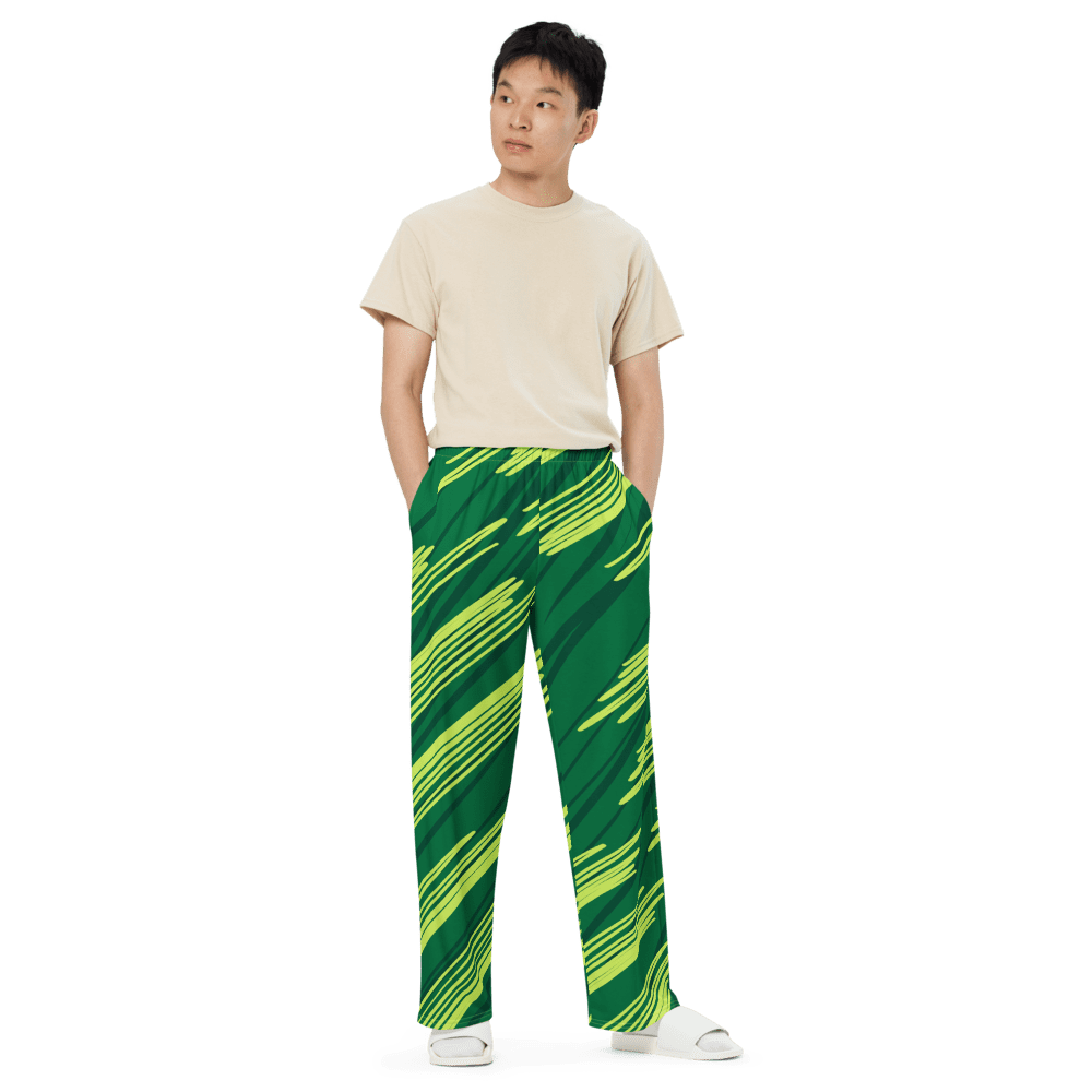 Man wearing beige shirt and patterned pants.
