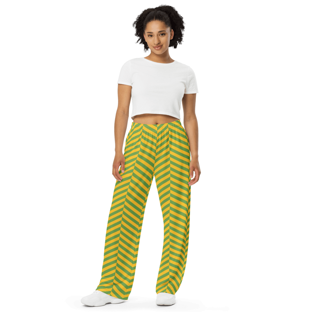 Woman wearing striped pants and white top.