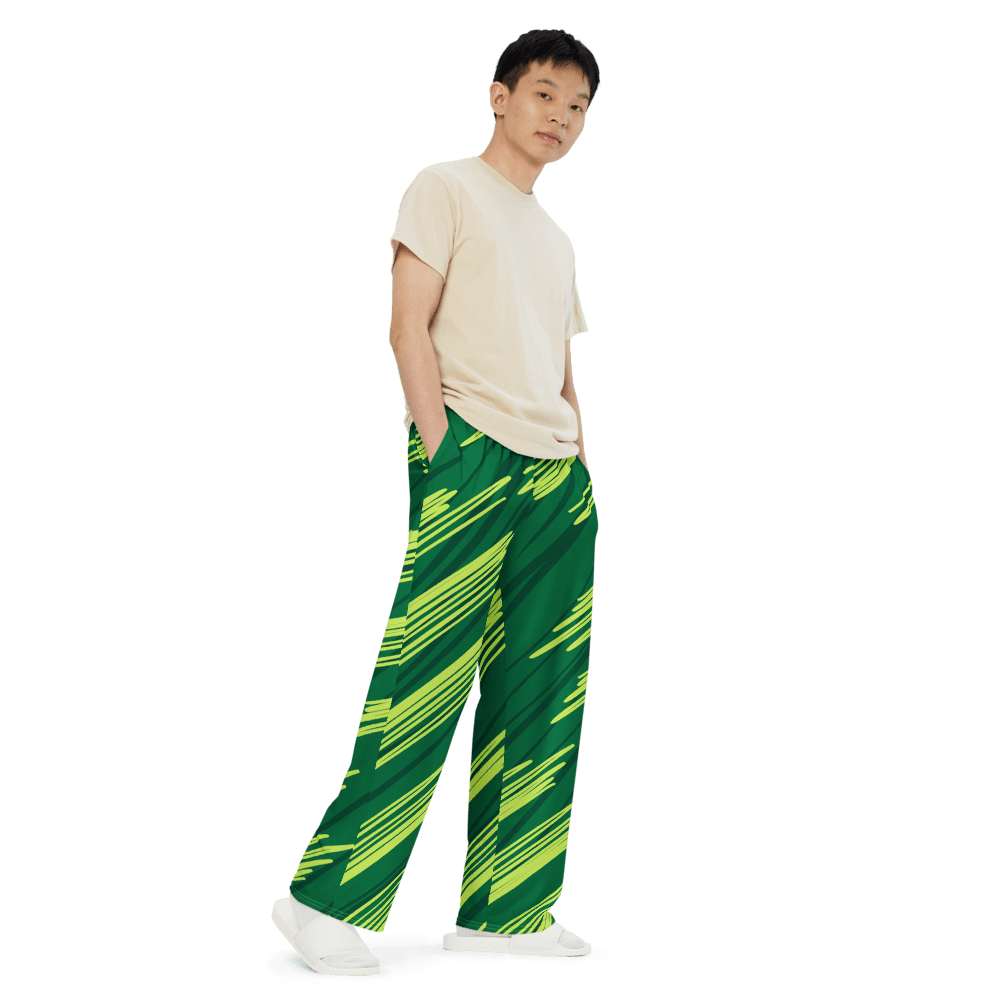 Person wearing green striped pants, black background.