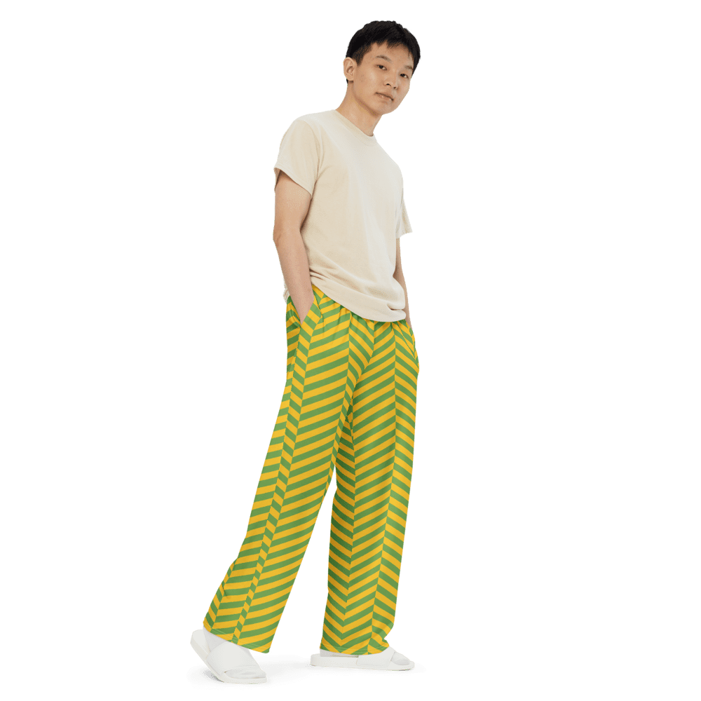 Person wearing striped pants, black background.