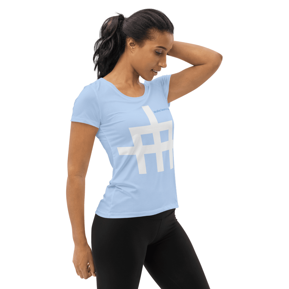 Woman wearing blue shirt with geometric design.